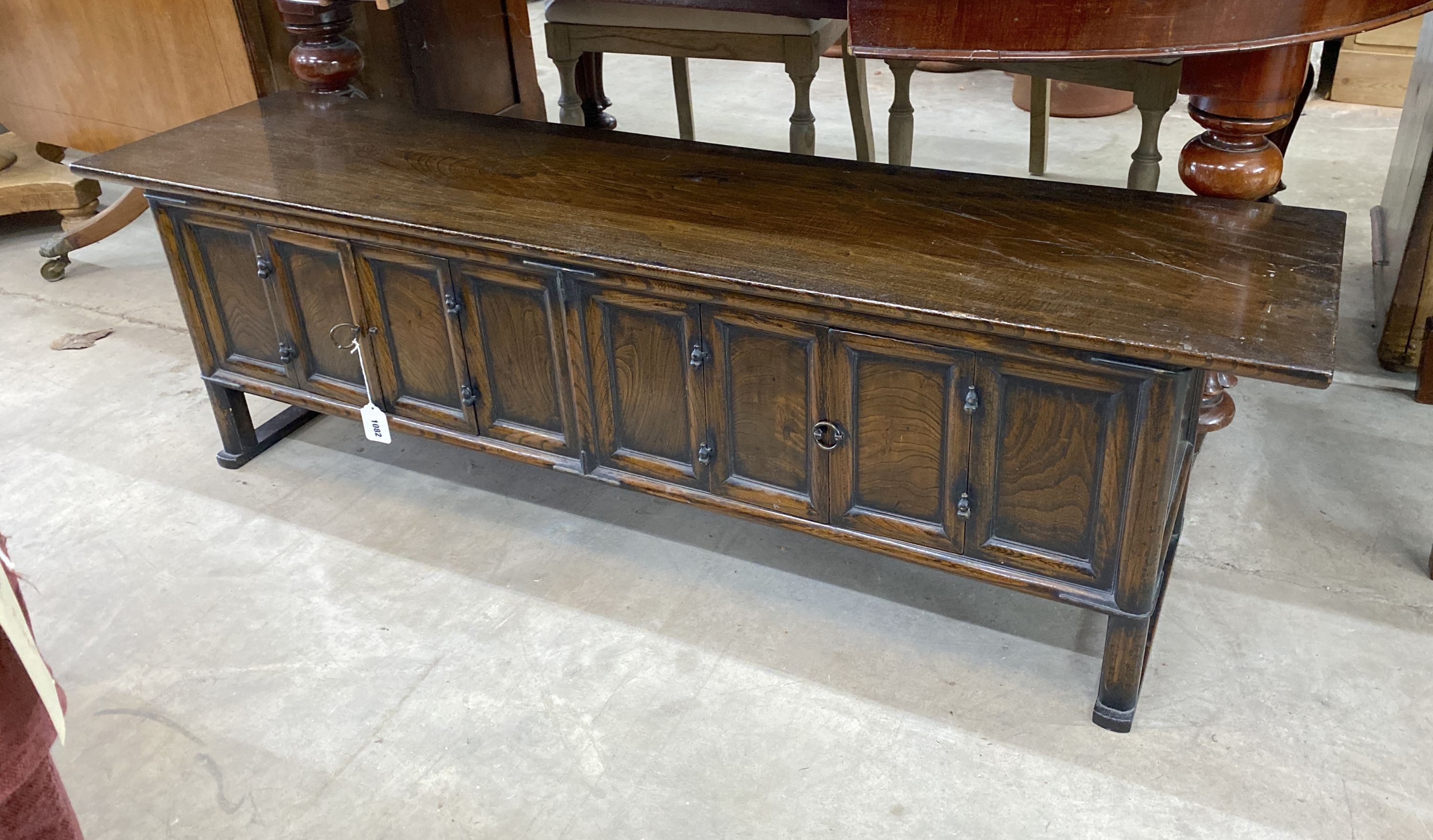 A Chinese elm low cabinet, length 145cm, depth 36cm, height 43cm